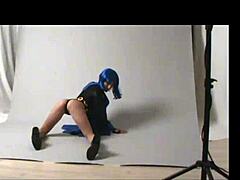 Teen amateur cosplays Raven outdoors in public