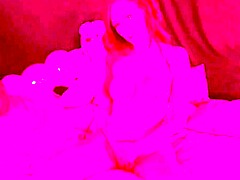 The Italian milf Artemisia Love smokes naked on the bed, displaying her big tits and playing with her pussy.