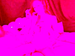 The Italian milf Artemisia Love smokes naked on the bed, displaying her big tits and playing with her pussy.