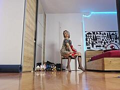 The blonde model showcases high heels in the glamorous fashion show, highlighting her short hair and feet with socks.