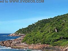 Redhead Latina Walks On Beach Publicly