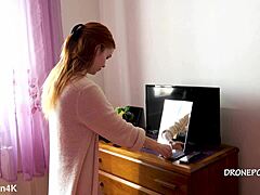 Beautiful naked redhead Karolinka applies makeup with cute European charm and small tits