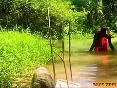 Fucking African whore hardcore by the stream with big dick