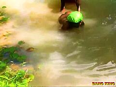 Fucking African whore hardcore by the stream with big dick