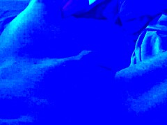under the blacklight, this chick with black feet gives an intense footjob, sucking on toes and all that fetish stuff
