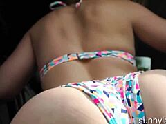 Blonde Sunny Lane fingers her big pussy to orgasm in the car