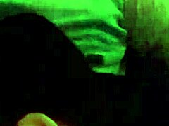 Couple enjoys intimate moment with friend watching