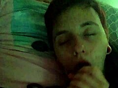 Couple enjoys intimate moment with friend watching