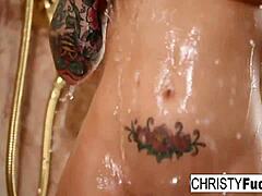 Christy Mack relaxes in the shower.