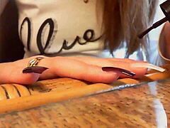 I relax with my long black nails and sexy hands in this ASMR video