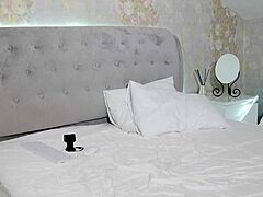 student with big tits undresses after studying on camera