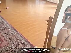 lexidona teases in the mirror while ripping off her clothes
