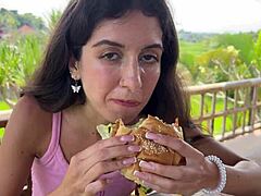Cute Girl Eating Burger With Cum On Her Face In Public Cafe