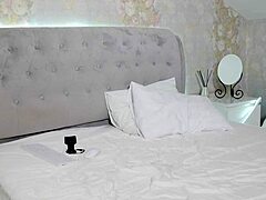 student with big tits undresses after studying on camera