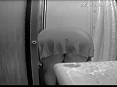 I'm spying on Jennifer bent over in the shower washing her shaved pussy