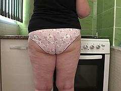 home camera captures mature housewife's big ass in panties during cleaning.