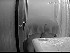 I'm spying on Jennifer bent over in the shower washing her shaved pussy