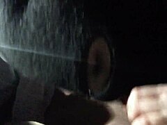 A woman gives a blowjob in the car with her friend