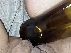 gretala, being pregnant and excited, rubs the bottle on her juicy pussy lips
