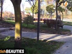 Brunette babe removes socks and walks barefoot in park