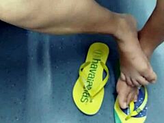 Candid Brazilian girl shows off flip flops in shoeplay