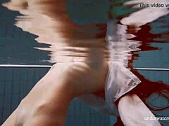 Hey, check out babe Lola's big natural tits underwater in the pool! 😍