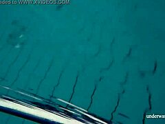 Hey, check out babe Lola's big natural tits underwater in the pool! 😍