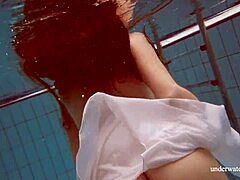 Hey, check out babe Lola's big natural tits underwater in the pool! 😍