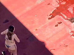 Neighbors sunbathing in bikinis on the terrace