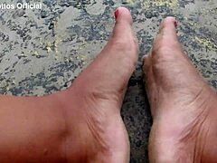 Dirty Wet Barefoot Feet on the Street