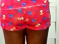 naked latina applies moisturizer outdoors