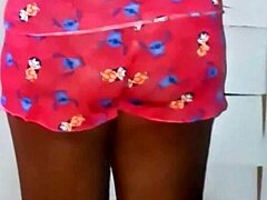 naked latina applies moisturizer outdoors