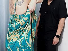 a store dressing room gets used by old couple for blowjob and doggystyle sex