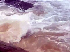 Young African girl flashes naked on beach