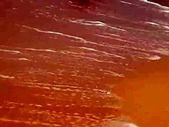 Young African girl flashes naked on beach