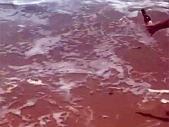 Young African girl flashes naked on beach