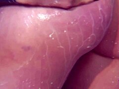 showering latex brunette