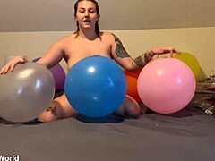 Emily pops balloons